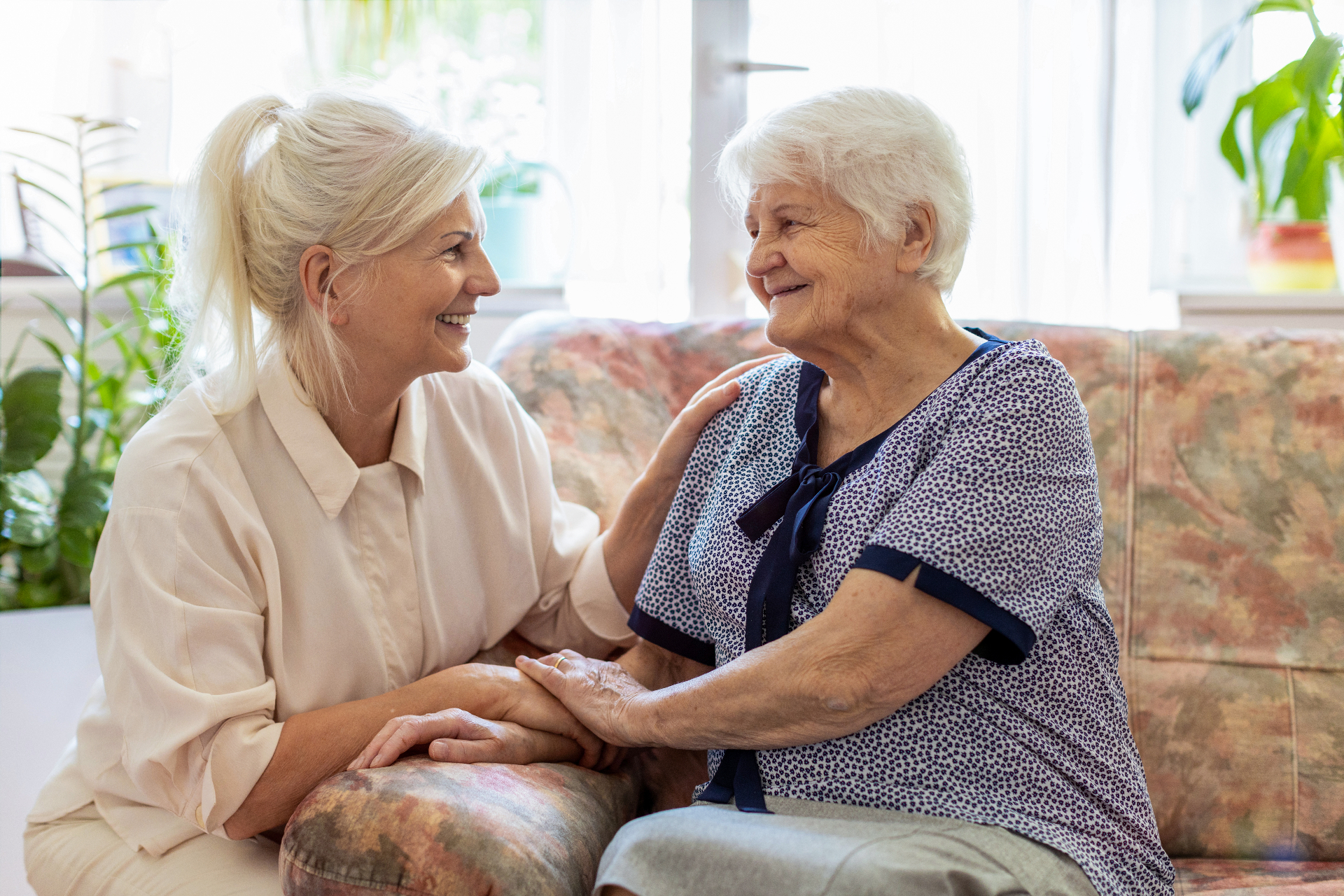 Two women smiling in care environment
